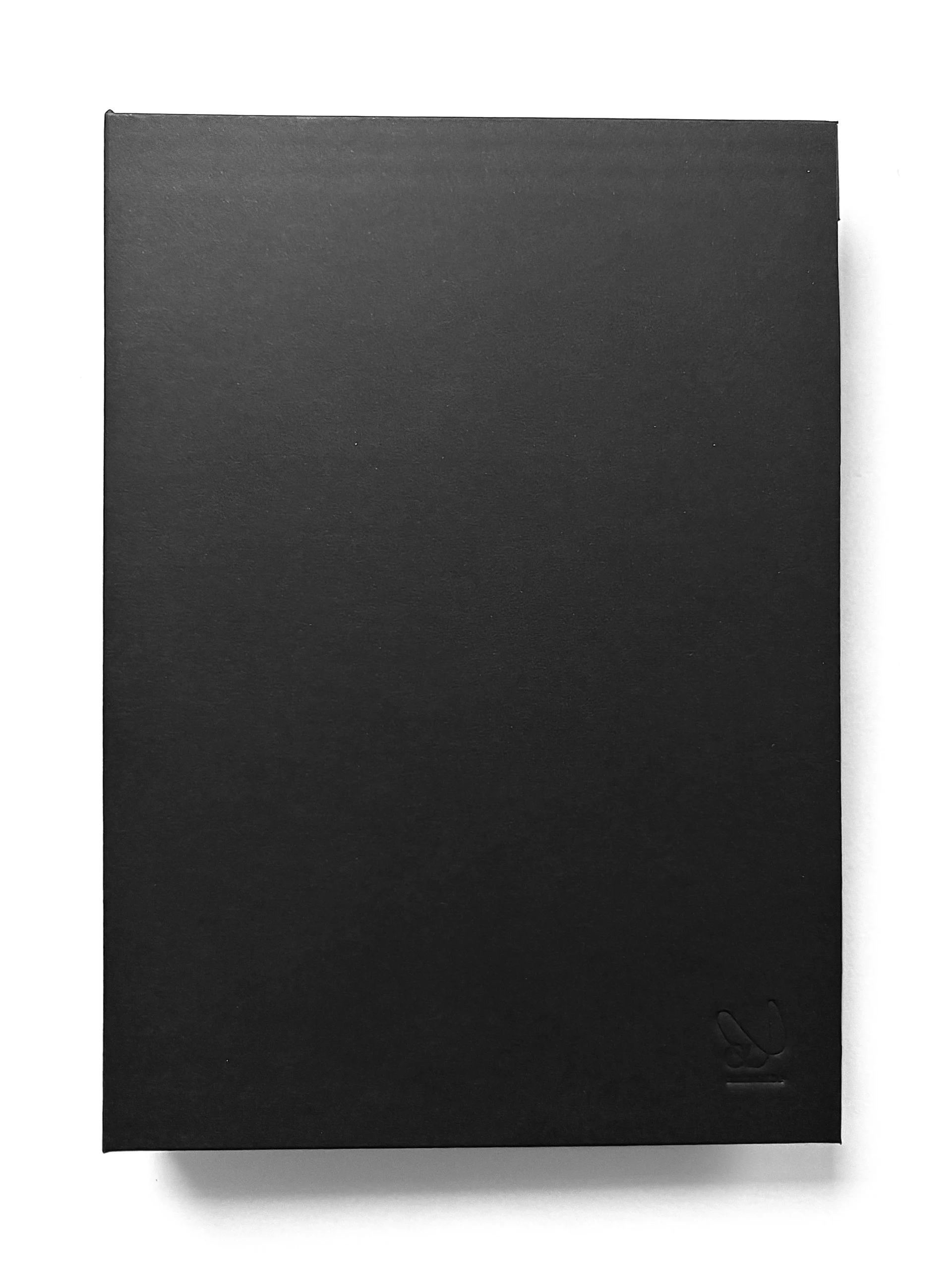 Memo_book with a matt black foil hardcover and matching black-coloured edges.
