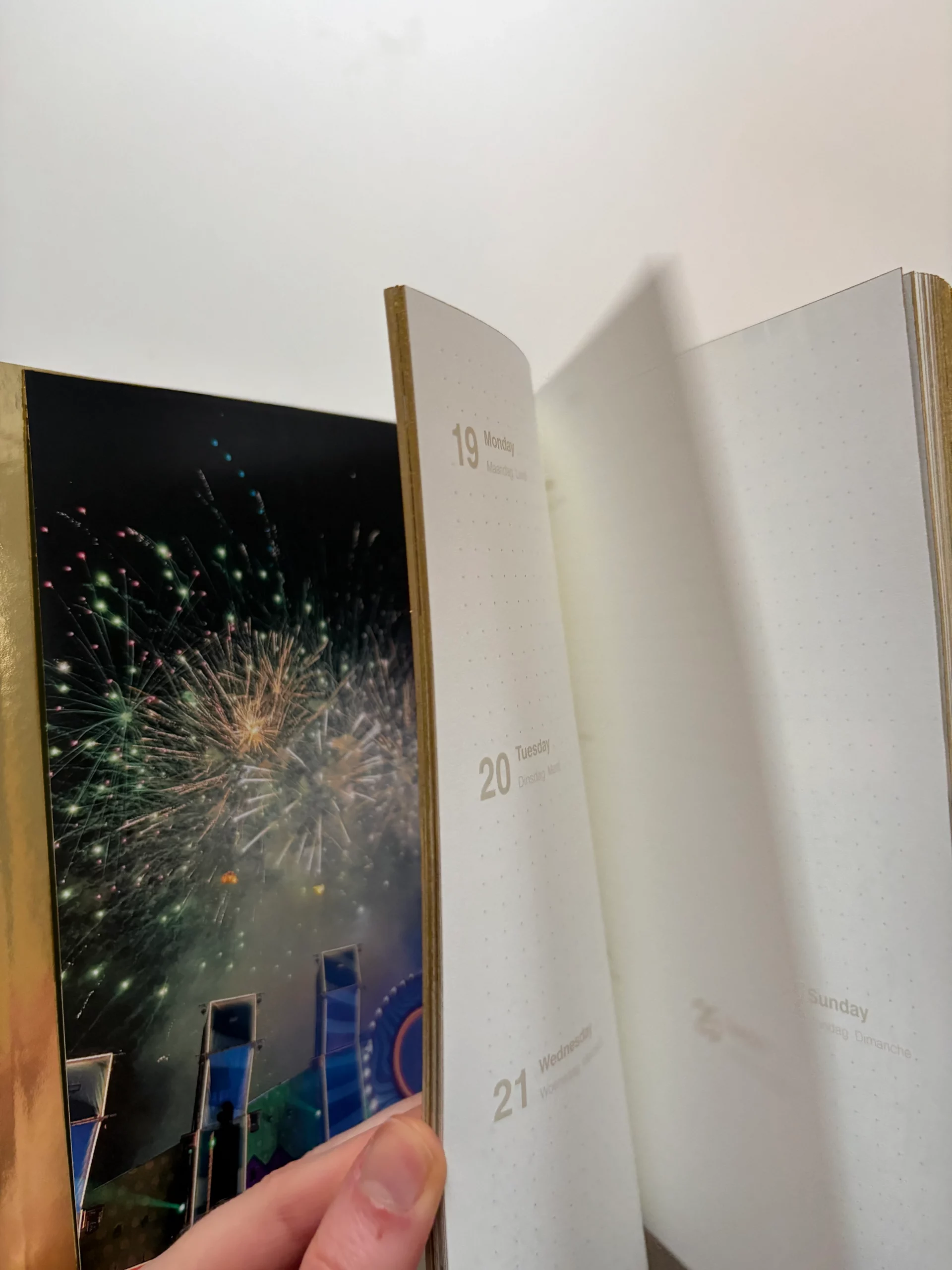 Memo_book with a mirror gold foil hardcover and matching gold-coloured edges.